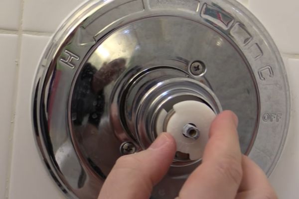 adjust scald guard on delta shower