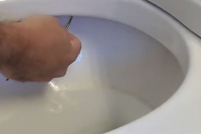 clean the blocked toilet bowl inlet holes
