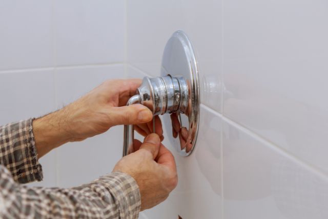 removing a Moen shower lever-styled handle