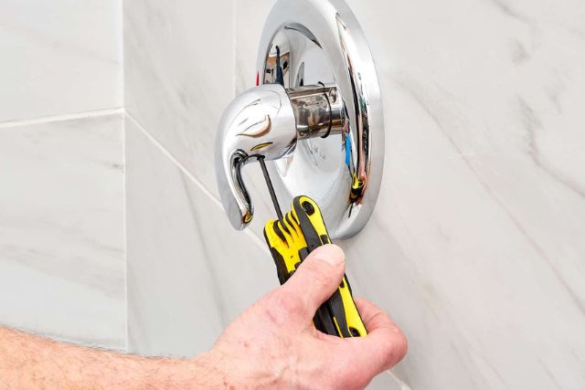 remove the old Moen shower handle