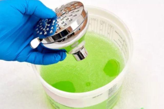 remove the showerhead stubborn deposits